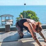 ocean view yoga with instructor at wellness retreat